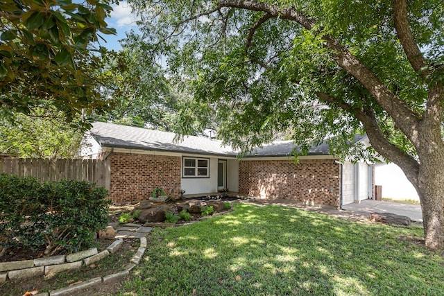 2200 Clover Park Dr, Arlington, TX 76013 - view of front of house with brick siding, an attached garage, and driveway