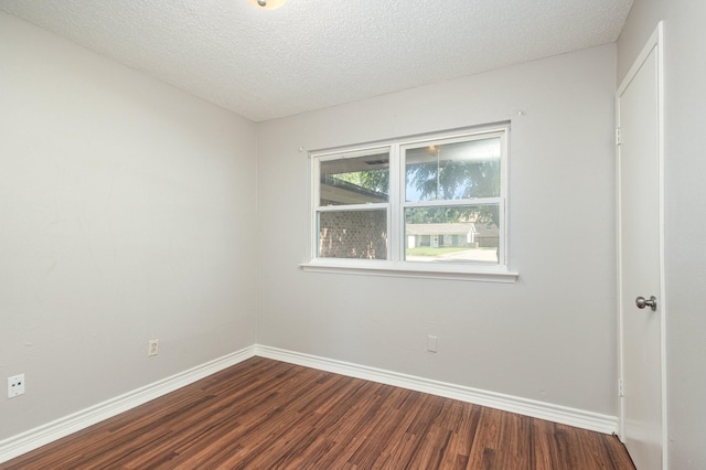 2200 Clover Park Dr, Arlington, TX 76013 - unfurnished room with dark wood finished floors and a textured ceiling