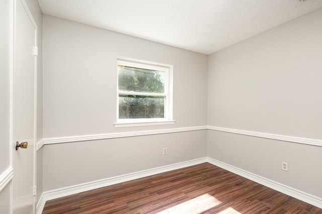 2200 Clover Park Dr, Arlington, TX 76013 - empty room with dark wood-type flooring and baseboards
