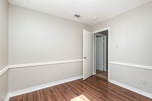 2200 Clover Park Dr, Arlington, TX 76013 - empty room with dark wood-style floors and baseboards