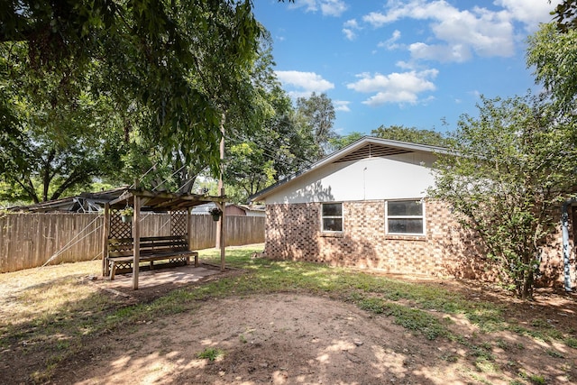 2200 Clover Park Dr, Arlington, TX 76013 - fenced backyard featuring a pergola and a patio