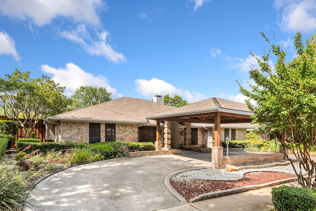 2621 Brennan Ct, Plano, TX 75075 - view of front facade with a chimney, driveway, a gazebo, brick siding, and roof with shingles