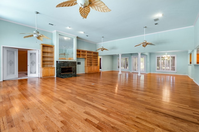 2621 Brennan Ct, Plano, TX 75075 - unfurnished living room with ceiling fan, crown molding, a fireplace, light wood-type flooring, and baseboards
