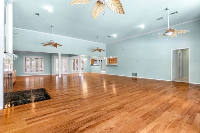 2621 Brennan Ct, Plano, TX 75075 - unfurnished living room featuring a ceiling fan, wood finished floors, ornamental molding, baseboards, and a high ceiling