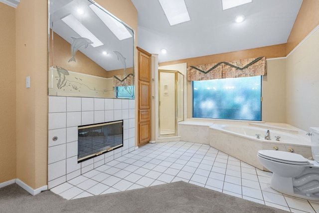2621 Brennan Ct, Plano, TX 75075 - full bathroom featuring a bath, lofted ceiling, a stall shower, a tile fireplace, and toilet