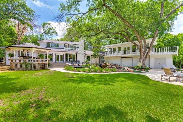 204 Varsity Cir, Arlington, TX 76013 - rear view of house featuring a balcony, a patio, a yard, french doors, and a chimney