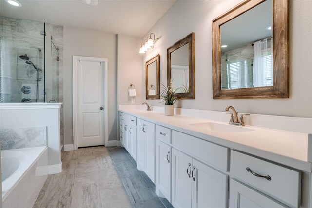9712 Surveyor Rd, Little Elm, TX 75068 - full bathroom with a shower stall, double vanity, a garden tub, and baseboards