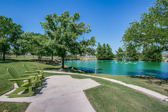 9712 Surveyor Rd, Little Elm, TX 75068 - view of home's community with a water view, a lawn, and a patio