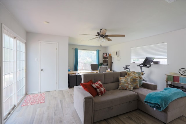 7251 Valley Dale Ct, Benbrook, TX 76116 - living area featuring light wood-style floors, ceiling fan, and a wall mounted air conditioner