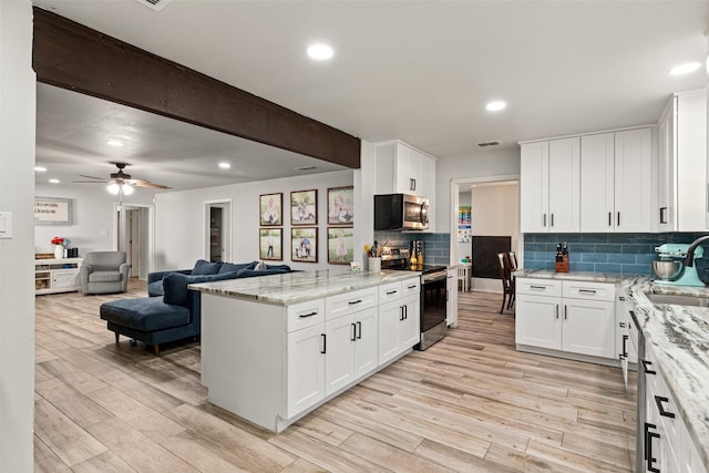 7251 Valley Dale Ct, Benbrook, TX 76116 - kitchen featuring stainless steel appliances, light wood-type flooring, backsplash, light stone countertops, and recessed lighting