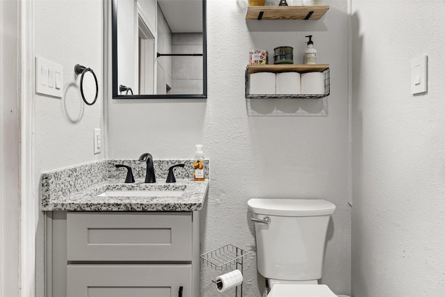 7251 Valley Dale Ct, Benbrook, TX 76116 - bathroom featuring vanity and a textured wall