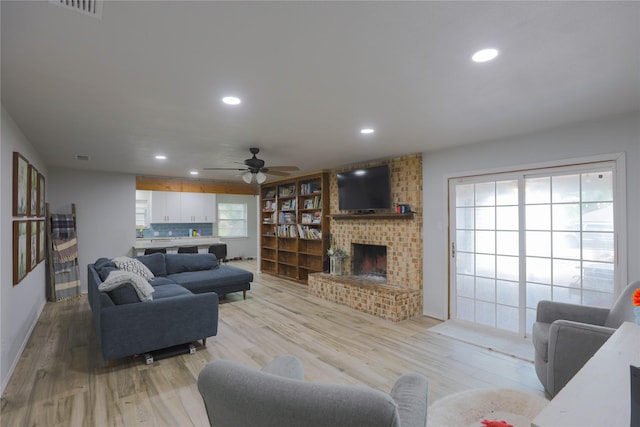 7251 Valley Dale Ct, Benbrook, TX 76116 - living room featuring ceiling fan, light wood-type flooring, recessed lighting, a fireplace, and baseboards