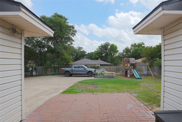 7251 Valley Dale Ct, Benbrook, TX 76116 - view of yard featuring a playground and concrete driveway
