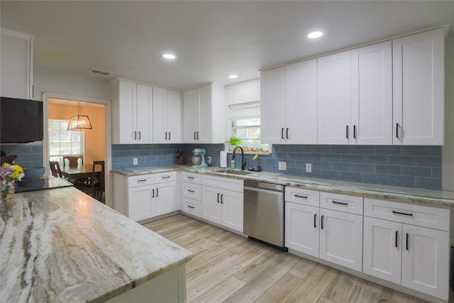7251 Valley Dale Ct, Benbrook, TX 76116 - kitchen with dishwasher, a sink, white cabinets, backsplash, and recessed lighting