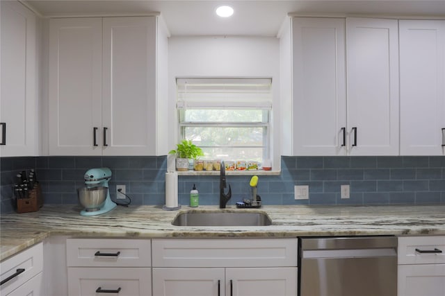 7251 Valley Dale Ct, Benbrook, TX 76116 - kitchen with stainless steel dishwasher, a sink, backsplash, white cabinets, and recessed lighting