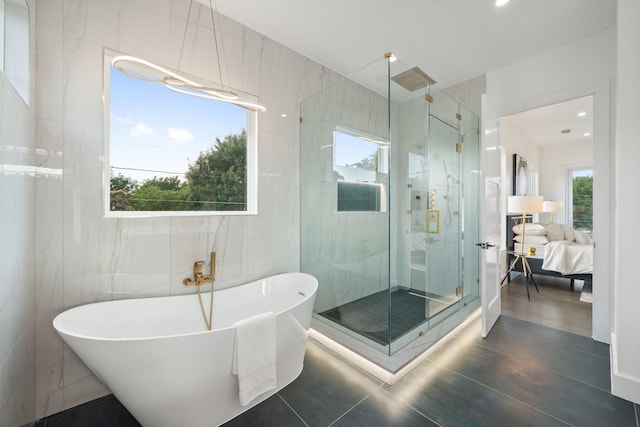 4233 Skillman St, Dallas, TX 75206 - ensuite bathroom with a stall shower, a freestanding bath, tile walls, and recessed lighting