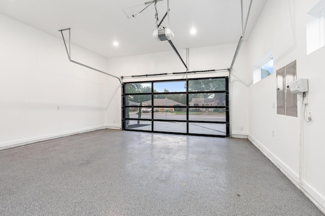 4233 Skillman St, Dallas, TX 75206 - garage featuring baseboards, a garage door opener, and electric panel