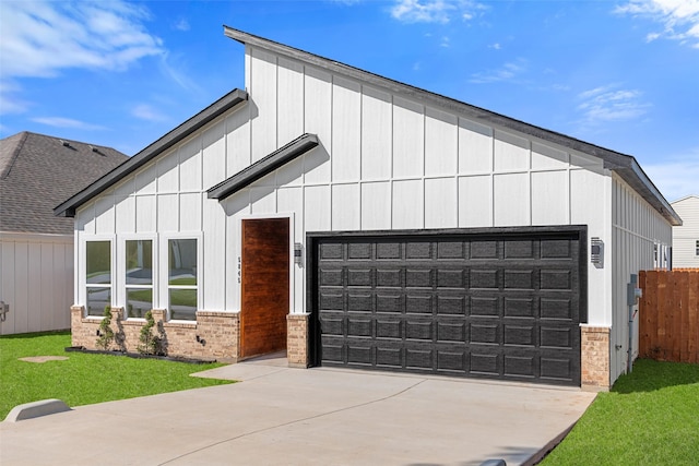 5845 Black Pine Cir, Granbury, TX 76048 - view of front of home featuring a garage, driveway, and brick siding