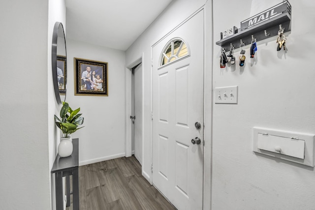 2605 Himes St, Irving, TX 75060 - doorway to outside with wood finished floors and baseboards