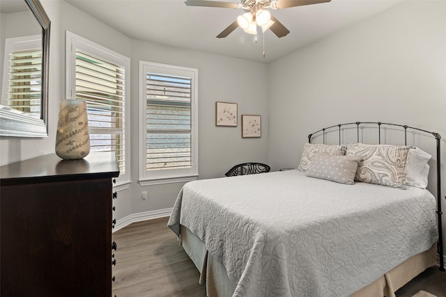 7700 Cerrito Trl, Fort Worth, TX 76123 - bedroom featuring wood finished floors, baseboards, and a ceiling fan