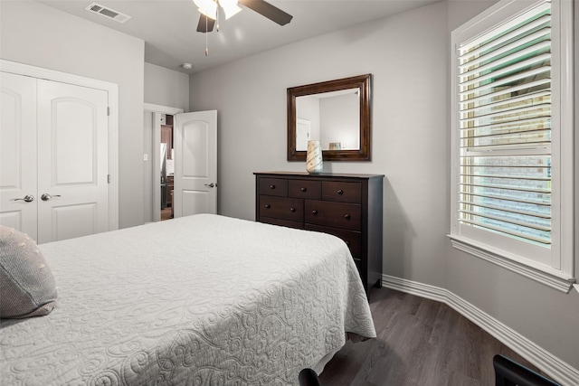 7700 Cerrito Trl, Fort Worth, TX 76123 - bedroom featuring dark wood-style flooring, a closet, baseboards, and ceiling fan