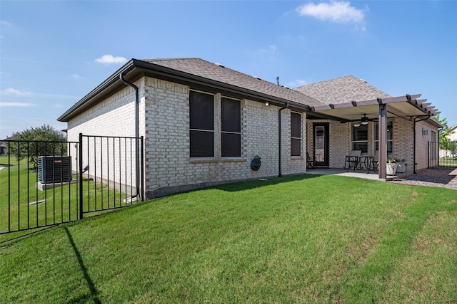 7700 Cerrito Trl, Fort Worth, TX 76123 - back of property featuring ceiling fan, a patio area, brick siding, a shingled roof, and a gate