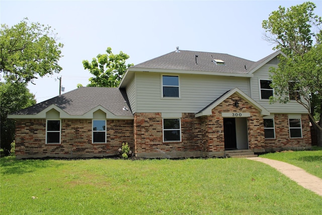 300 Woodhollow Ct, Wylie, TX 75098 - view of front of property featuring a front lawn, brick siding, and roof with shingles