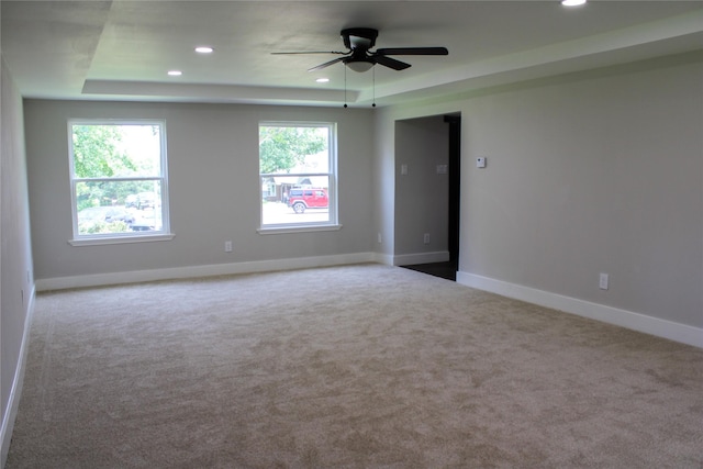 300 Woodhollow Ct, Wylie, TX 75098 - spare room featuring a tray ceiling, ceiling fan, carpet, recessed lighting, and baseboards