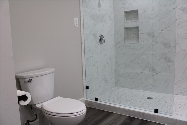 300 Woodhollow Ct, Wylie, TX 75098 - bathroom featuring a shower stall, toilet, and wood finished floors