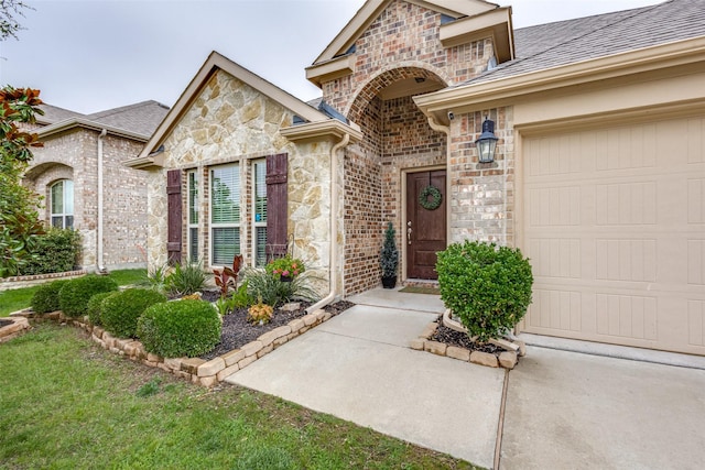2637 Hillrich Dr, Anna, TX 75409 - doorway to property with stone siding, an attached garage, and a shingled roof