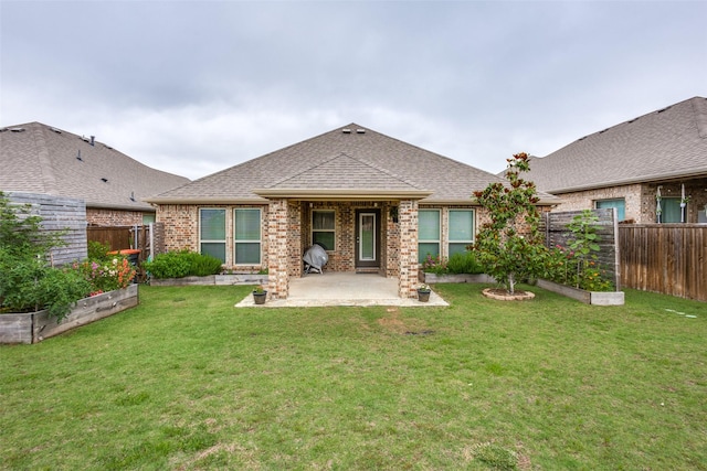 2637 Hillrich Dr, Anna, TX 75409 - rear view of property featuring a garden, a patio area, brick siding, and roof with shingles