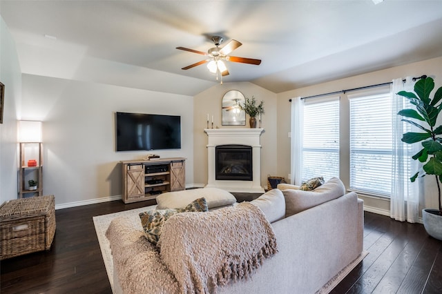 2637 Hillrich Dr, Anna, TX 75409 - living area with baseboards, a ceiling fan, a glass covered fireplace, dark wood-style floors, and lofted ceiling