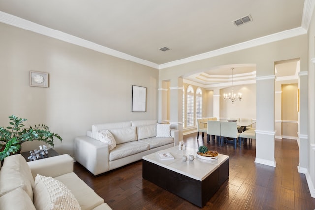 1415 Cambridge Xing, Southlake, TX 76092 - living room featuring crown molding, dark wood-style floors, a chandelier, baseboards, and arched walkways