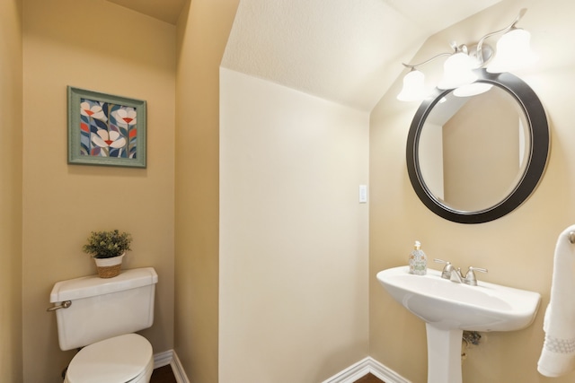 1415 Cambridge Xing, Southlake, TX 76092 - half bath featuring toilet, baseboards, and vaulted ceiling