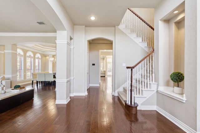 1415 Cambridge Xing, Southlake, TX 76092 - foyer entrance featuring arched walkways, stairs, dark wood-style floors, and baseboards