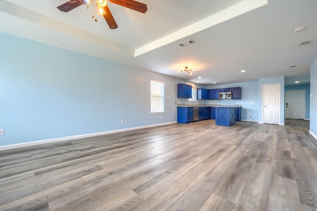14713 Brandon Dr, Little Elm, TX 75068 - unfurnished living room with ceiling fan, light wood finished floors, and recessed lighting