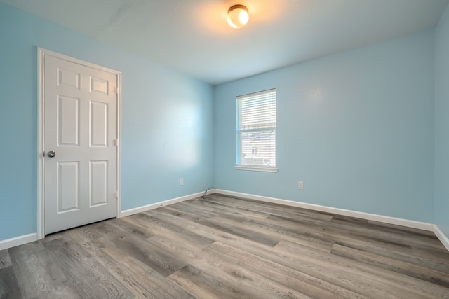 14713 Brandon Dr, Little Elm, TX 75068 - empty room featuring wood finished floors and baseboards