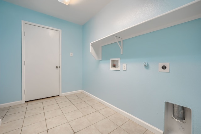 14713 Brandon Dr, Little Elm, TX 75068 - laundry area with hookup for a washing machine, hookup for an electric dryer, hookup for a gas dryer, and light tile patterned floors