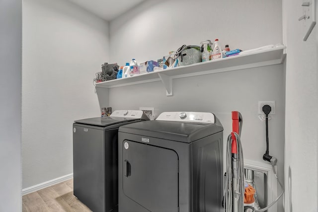 9752 New Bern Dr, Fort Worth, TX 76108 - washroom featuring separate washer and dryer, light wood-style floors, and baseboards