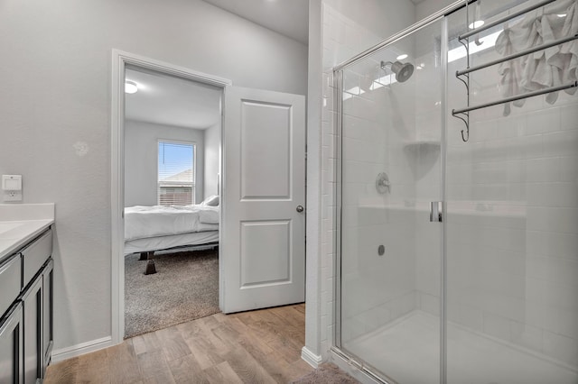 9752 New Bern Dr, Fort Worth, TX 76108 - ensuite bathroom featuring wood finished floors, a shower stall, and vanity
