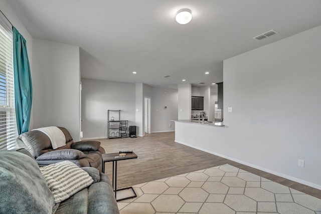 9752 New Bern Dr, Fort Worth, TX 76108 - living area featuring light wood finished floors, recessed lighting, and baseboards