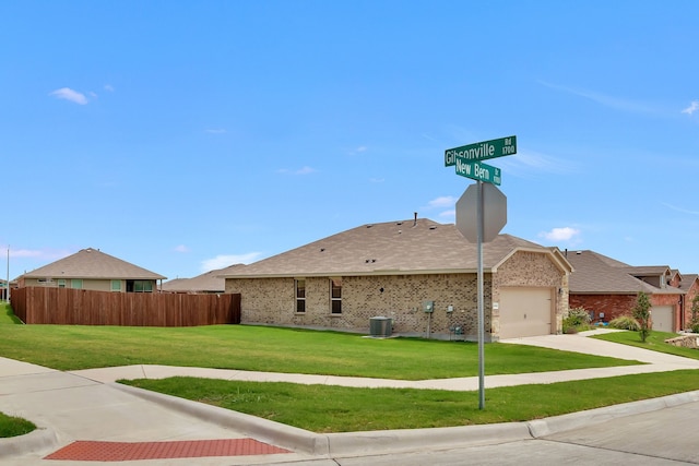 9752 New Bern Dr, Fort Worth, TX 76108 - view of front of property featuring central air condition unit, concrete driveway, an attached garage, a shingled roof, and brick siding