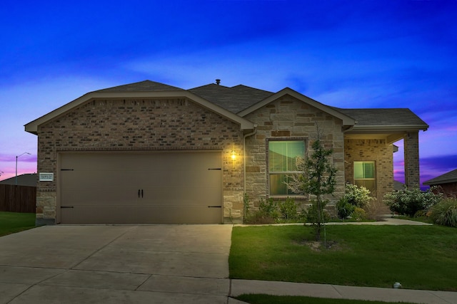 9752 New Bern Dr, Fort Worth, TX 76108 - view of front facade with an attached garage, stone siding, concrete driveway, a lawn, and brick siding