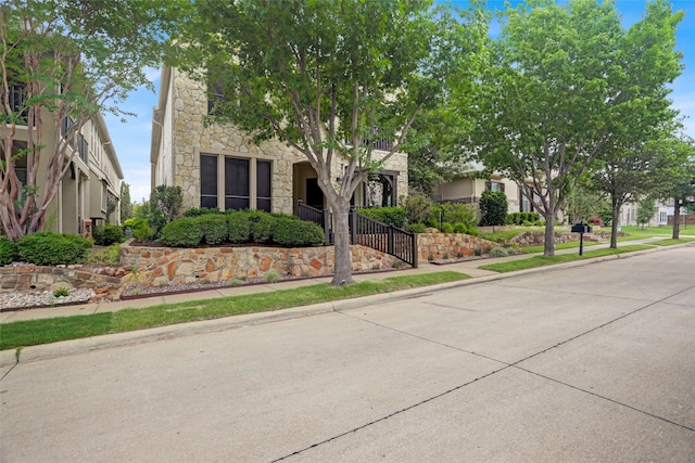 7904 Chickasaw Trl, Mckinney, TX 75070 - view of property hidden behind natural elements with stone siding
