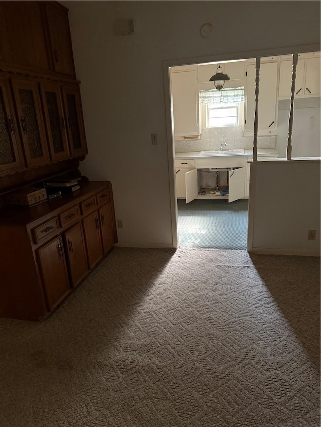 820 Goshen Rd, Springtown, TX 76082 - hallway featuring dark colored carpet and a sink