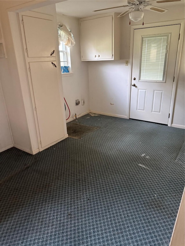 820 Goshen Rd, Springtown, TX 76082 - laundry area featuring dark colored carpet, a ceiling fan, and baseboards