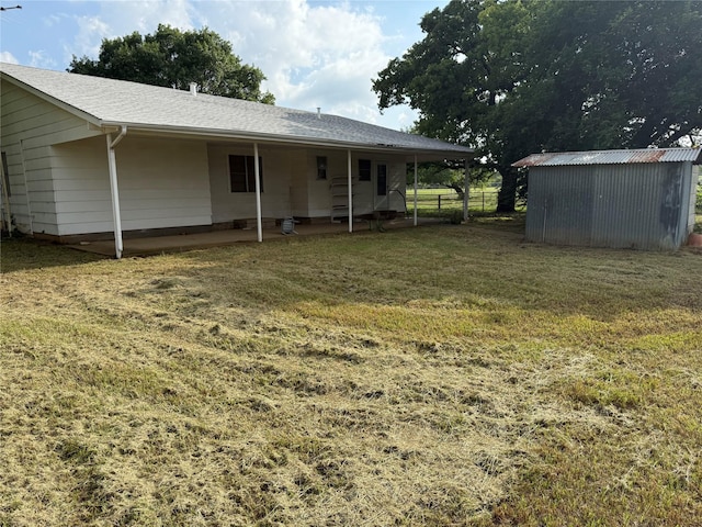 820 Goshen Rd, Springtown, TX 76082 - view of green lawn with an outbuilding and a patio