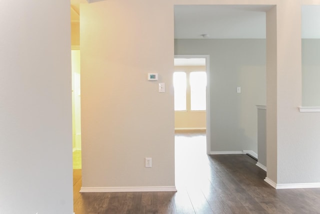 1513 Kittyhawk Dr, Little Elm, TX 75068 - hallway featuring dark wood-type flooring and baseboards