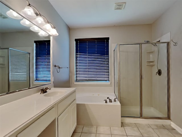 1104 Cactus Spine Dr, Fort Worth, TX 76052 - full bathroom featuring tile patterned flooring, vanity, a shower stall, and a garden tub