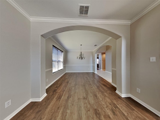 1104 Cactus Spine Dr, Fort Worth, TX 76052 - empty room with ornamental molding, dark wood-type flooring, arched walkways, a chandelier, and baseboards